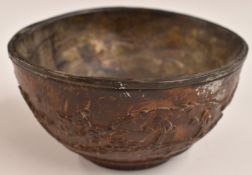 An 18th/19thC Chinese carved coconut shell or similar cup with relief decoration and pewter/