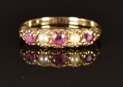 A 9ct gold ring set with pearls and rubies, size M, 1.6g