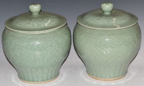 A pair of Chinese celadon glazed covered vases, H26 x D24cm