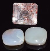 A loose Strawberry quartz, two onyx and two opals