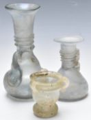 Three Roman / Roman style glass vases, tallest 17cm