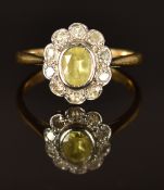 An 18ct gold ring set with a peridot and diamonds, size K/L, 2.7g