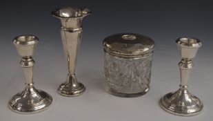 A pair of hallmarked silver candlesticks, height 10.5cm, hallmarked silver trumpet vase, height 13.