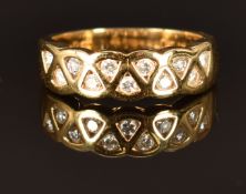 An 18ct gold ring set with diamonds totalling approximately 0.2ct, size M, 5.4g
