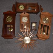 Seth Thomas starburst 1950/60s wall clock together with four c1910 wall clocks and a Temco