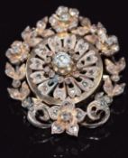 A c1900 continental gold brooch set with old cut diamonds in a tiered floral setting, 14.4g