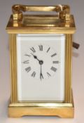 A c1930s brass carriage clock with reeded decoration to corners, H11.5cm