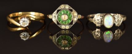 A silver ring set with an opal cabochon, maker GP, a 9ct gold ring set with a diamond and a 9ct gold