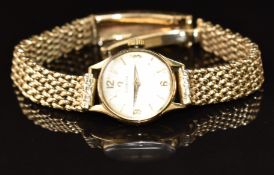 Omega 9ct gold ladies wristwatch with gold dauphine hands, gold hour markers, silver dial and signed
