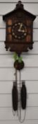 Early to mid 20thC German cuckoo clock with wooden cuckoo and 'pipes', set in architectural form
