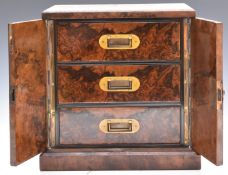 Victorian burr walnut collector's cabinet, the doors locked by Brahmah lock, opening to reveal the