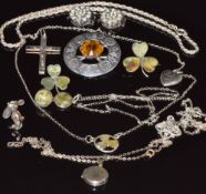 A hallmarked silver Scottish brooch by Robert Allison, two silver brooches in the form of clovers