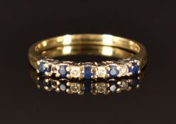 A 9ct gold ring set with diamonds and sapphires, size M, 1.5g