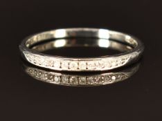 A 9ct white gold half eternity ring set with diamonds, size N, 1.2g