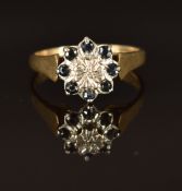 A 9ct gold ring with a diamond and sapphires, size M/N, 2.8g