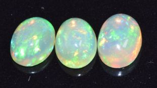 Three loose oval opal cabochons, measuring a total of approximately 2.93cts