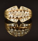 A 14k gold ring set with round and baguette cut diamonds, size O, 6g