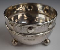 Albert Edward Jones Arts and Crafts hallmarked silver bowl with hammered finish, raised on three