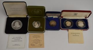 A cased silver hallmarked Oman Arabic coin 29.8g, 32mm diameter, together with Royal Mint Madagascar