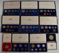 Eight cased South African Mint coin sets spanning 1960s-1980s, with silver content.