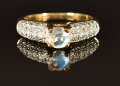 A 9k gold ring set with a moonstone and zircon, size N, 3g