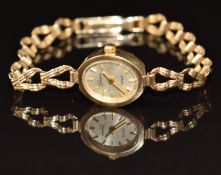 Swiss 9ct gold ladies wristwatch with gold hands and hour markers, silver dial and quartz