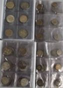 Four Harris and Co coin collector's albums containing shillings, two shillings and half crown