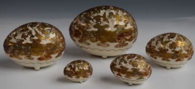 Five Japanese Satsuma nesting eggs, largest 13 x 9cm