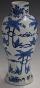 Chinese 19thC blue and white bottle vase of waisted form decorated with flowers, H26cm