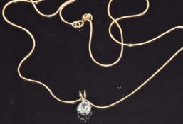 An 18ct gold pendant set with an old cut diamond of approximately 0.35ct on 9ct gold chain