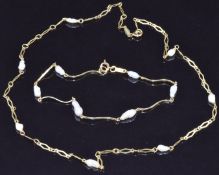 A 9ct gold necklace set with pearls and a similar bracelet, 4.9g