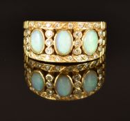 An 18ct gold ring set with opals and diamonds, size N/O, 6g