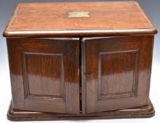 Walker & Hall oak cutlery canteen, the doors opening to reveal four drawers, together with a