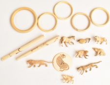 A collection of late 19thC / 20thC Japanese Meiji period carved ivory / bone animals, cheroot