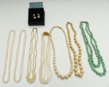 A double strand jade necklace with silver clasp, three pearl necklaces, pearl earrings etc