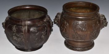 Two Chinese bronze jardinieres decorated with birds and prunus blossom, one with twin mask