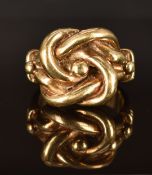 A 9ct gold ring in the form of a Gordian style knot, size Z4, 30.9g