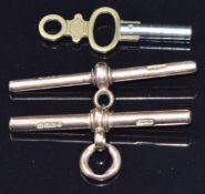 Two 9ct gold T bars (8.8g) and a pocket watch key