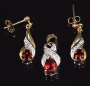A 9ct gold pendant set with a garnet and diamonds, with matching earrings, 3.1g