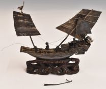 Chinese or similar silver model of a sailing boat or junk, length 10cm, weight including wooden
