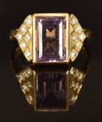 An 18ct gold ring set with an amethyst and diamonds, size L, 5.6g