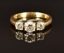 A 10k gold ring set with three diamonds, total diamond weight approximately 0.8ct, size M, 4.3g
