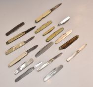 Seventeen folding pocket knives including two hallmarked silver bladed mother of pearl examples