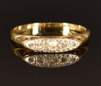 An 18ct gold ring set with diamonds in a platinum setting, size I, 2.0g