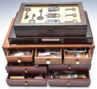 A padlock and key collection in collector's chest and framed display, including 18th/19thC and many