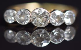 An 18ct gold ring set with five diamonds, the largest approximately 0.5ct, total diamond weight