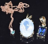 A 14k gold pendant set with Alexandrite on a 9ct gold chain and two 9k gold pendants, one set with