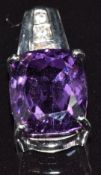 A 9k white gold pendant set with an amethyst and zircons, 3.2g