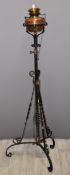 In the manner of WAS Benson Victorian wrought iron and copper extending oil lamp, H152cm