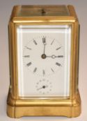 Late 19th/ early 20thC brass carriage clock with repeater and alarm features, white enamel Roman